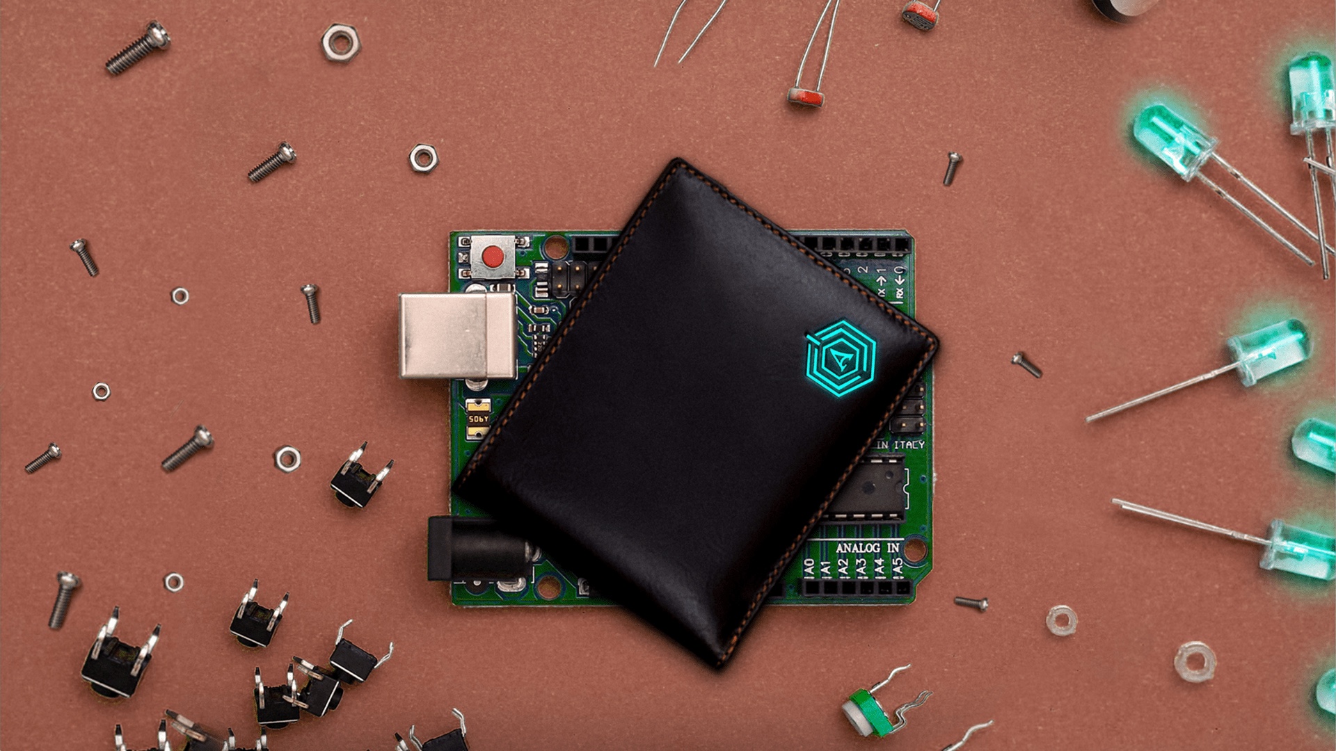 Wallet Bot smart wallet on a circuit board surrounded by electronic components